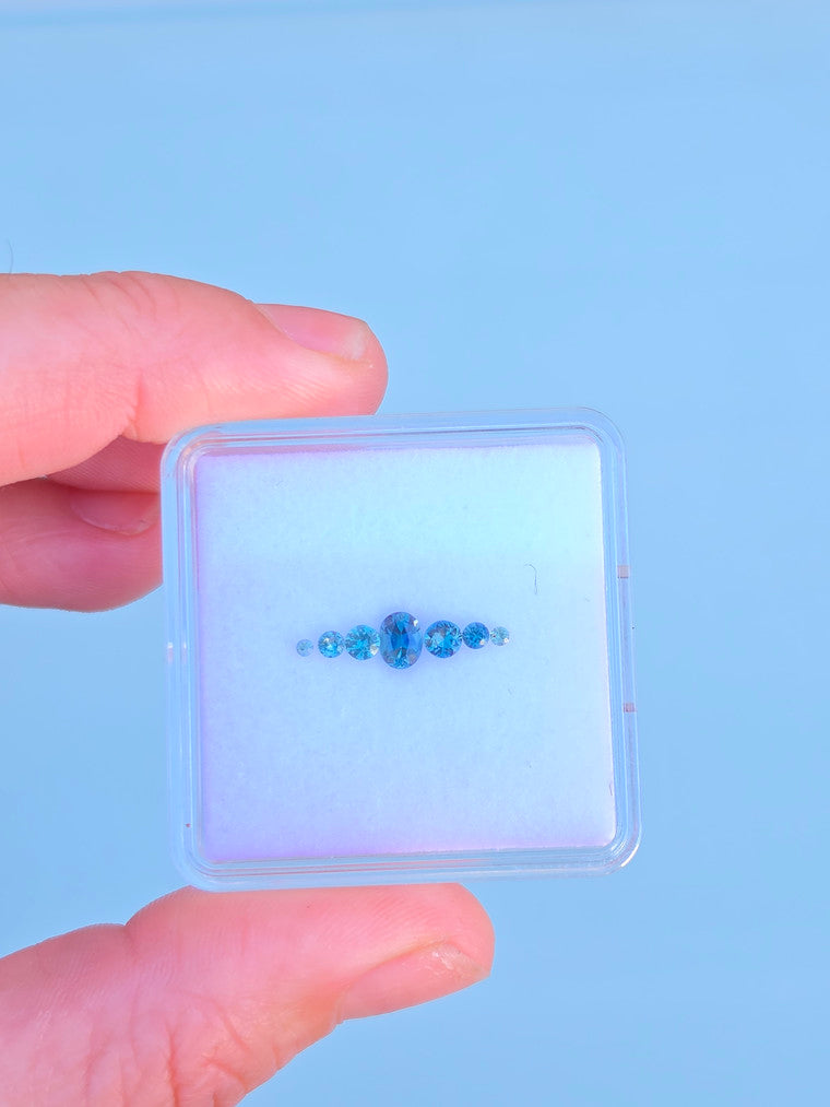 Set of 7 Oval & Round Blue Parti Sapphires