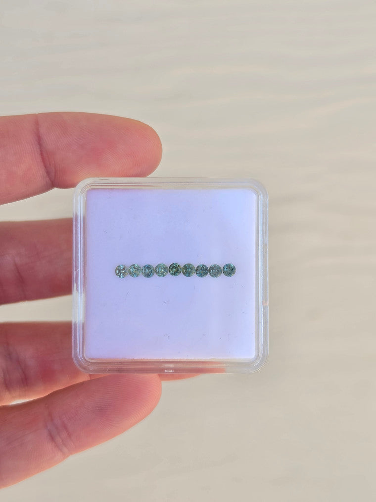 Set of 9 Round green sapphires