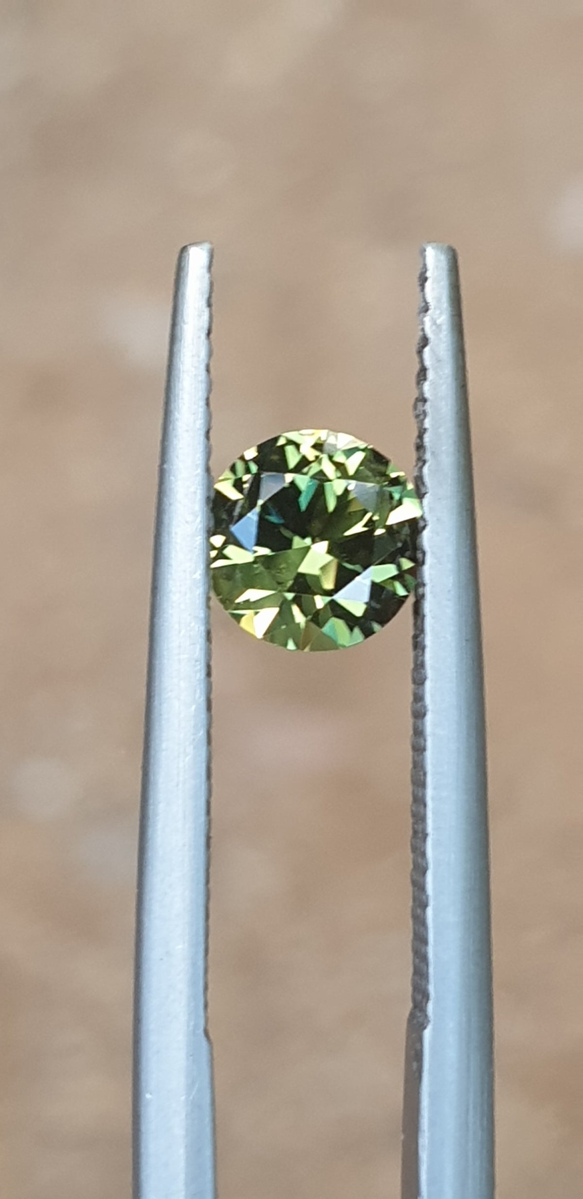 .77ct Round Yellow-Green Parti Sapphire