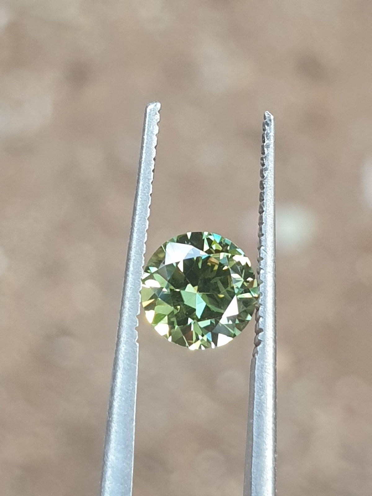 1.06ct Round Yellow-Green Parti Sapphire