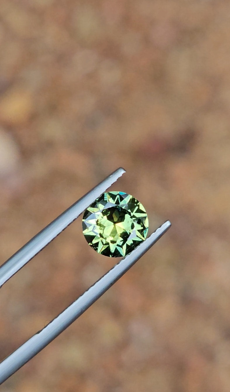 1.53ct Round Light Green Parti Sapphire