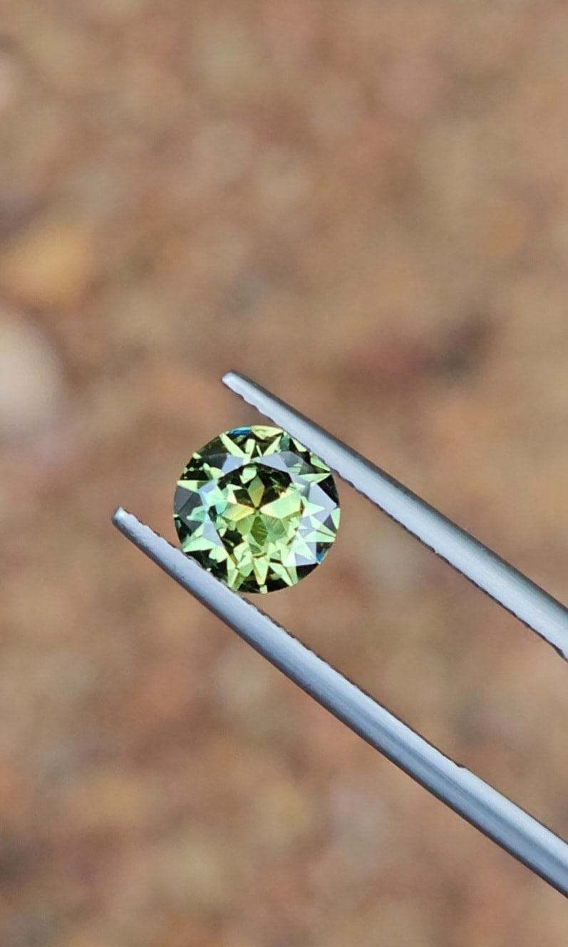 1.53ct Round Light Green Parti Sapphire