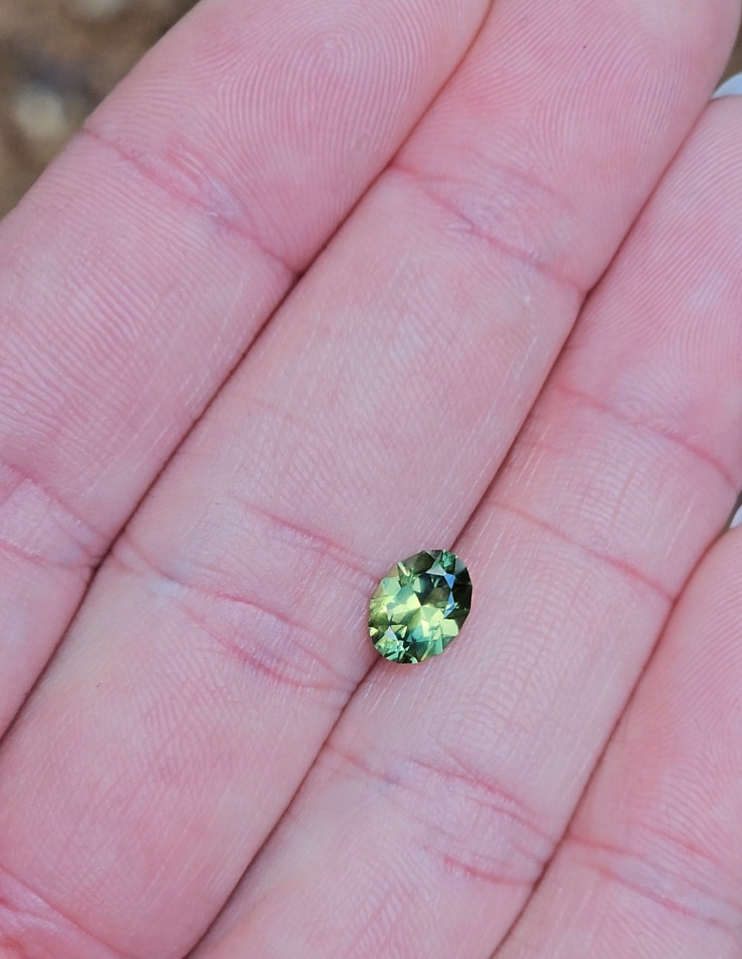 1.36ct Oval Green Parti Sapphire