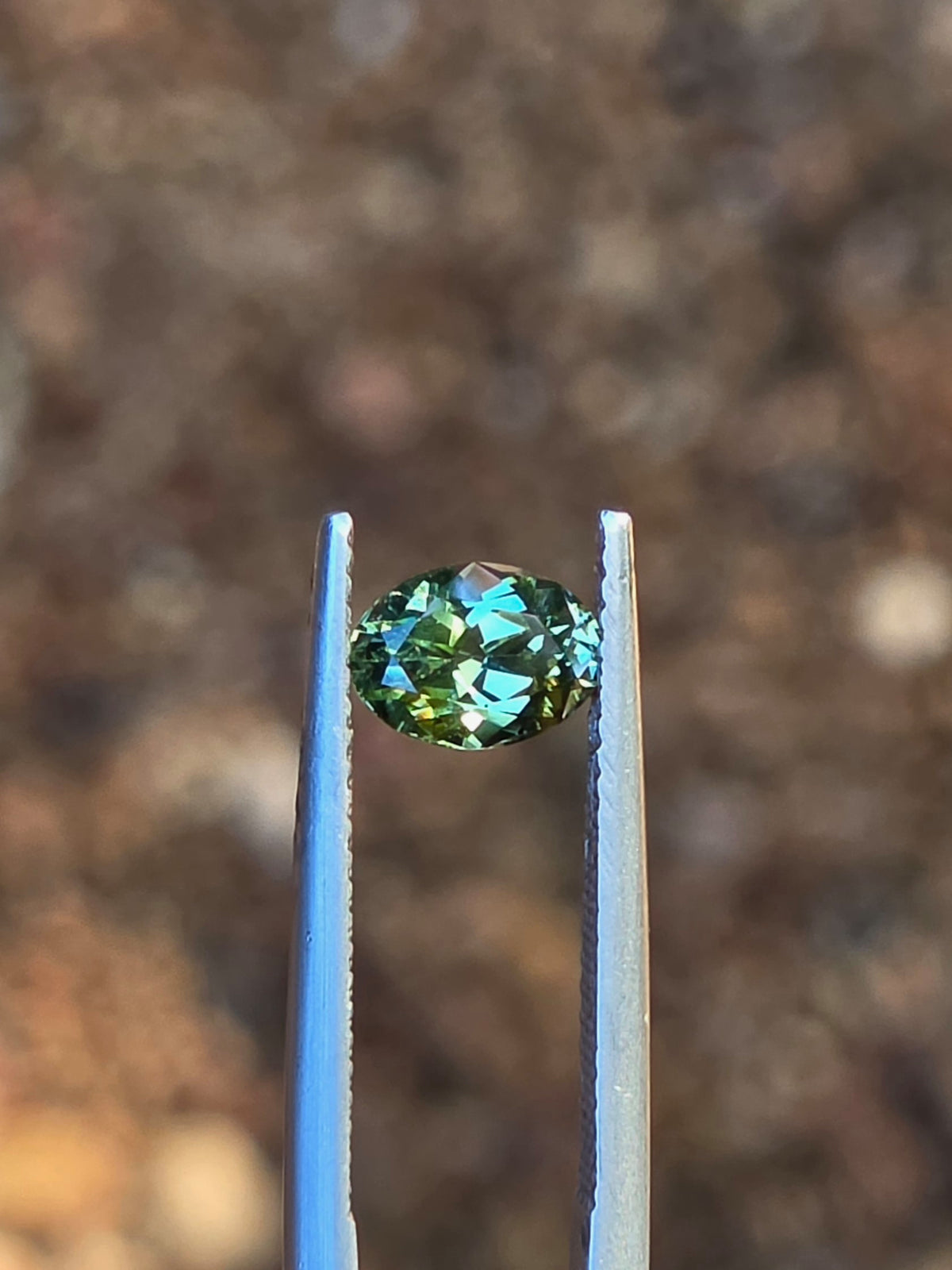 1.12ct Oval Green Parti Sapphire