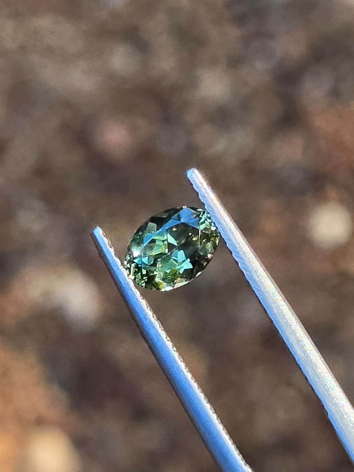 1.12ct Oval Green Parti Sapphire