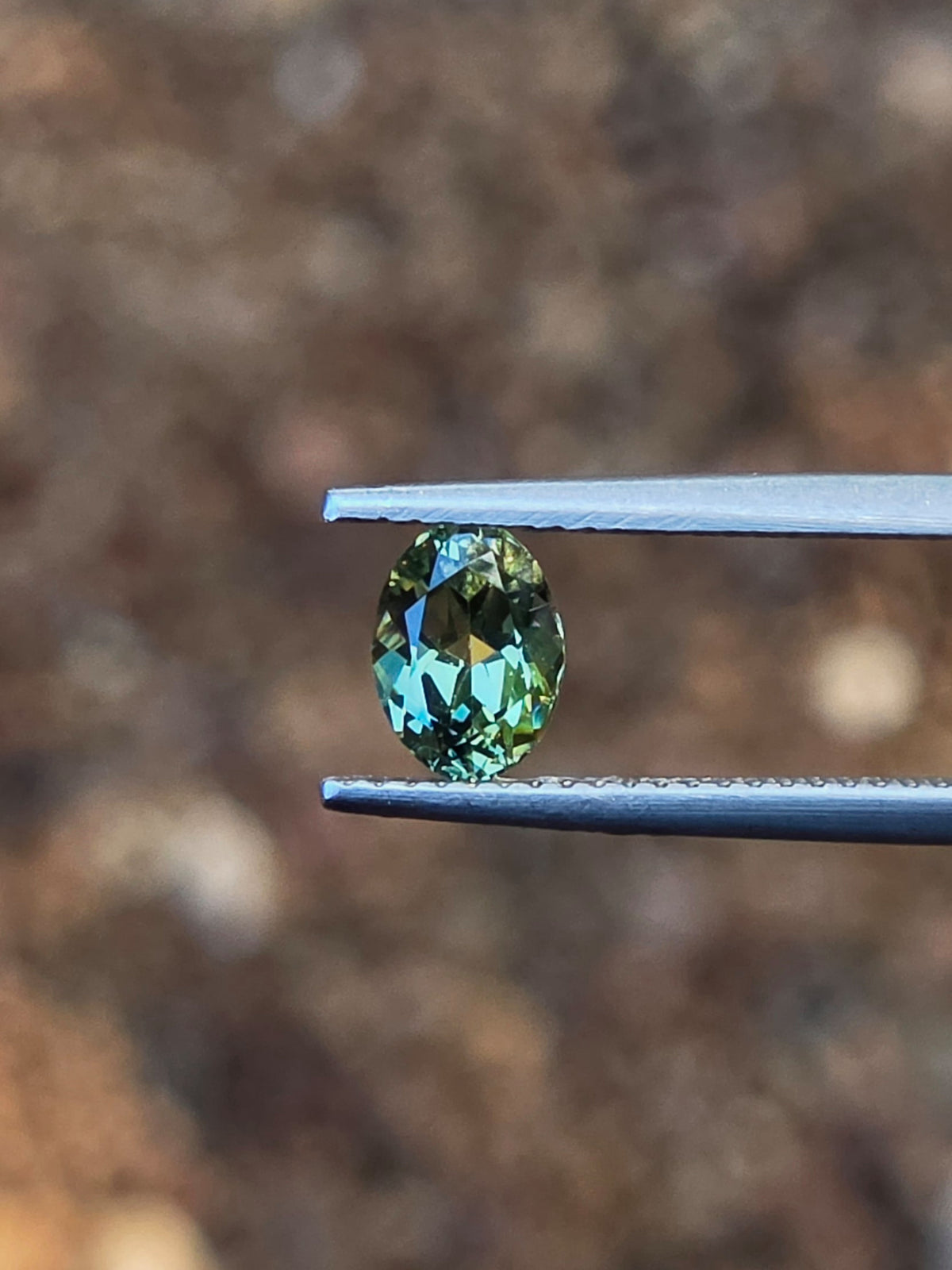 1.12ct Oval Green Parti Sapphire