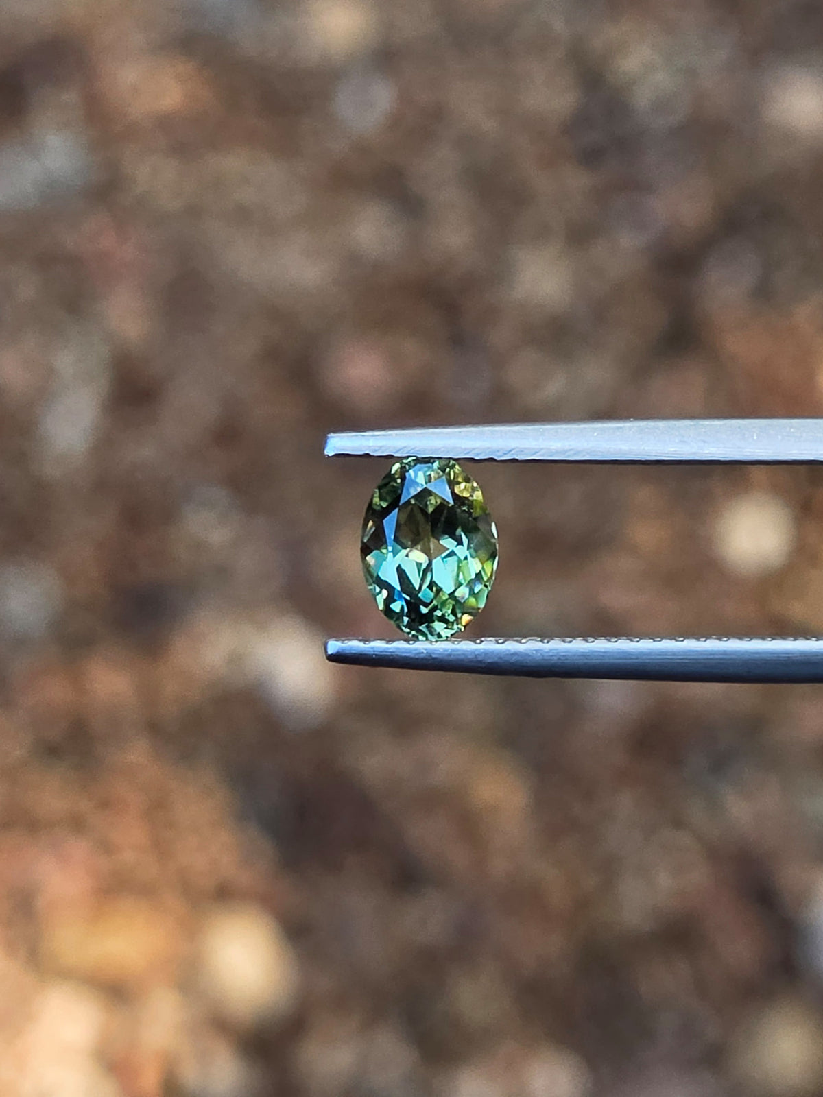 1.12ct Oval Green Parti Sapphire