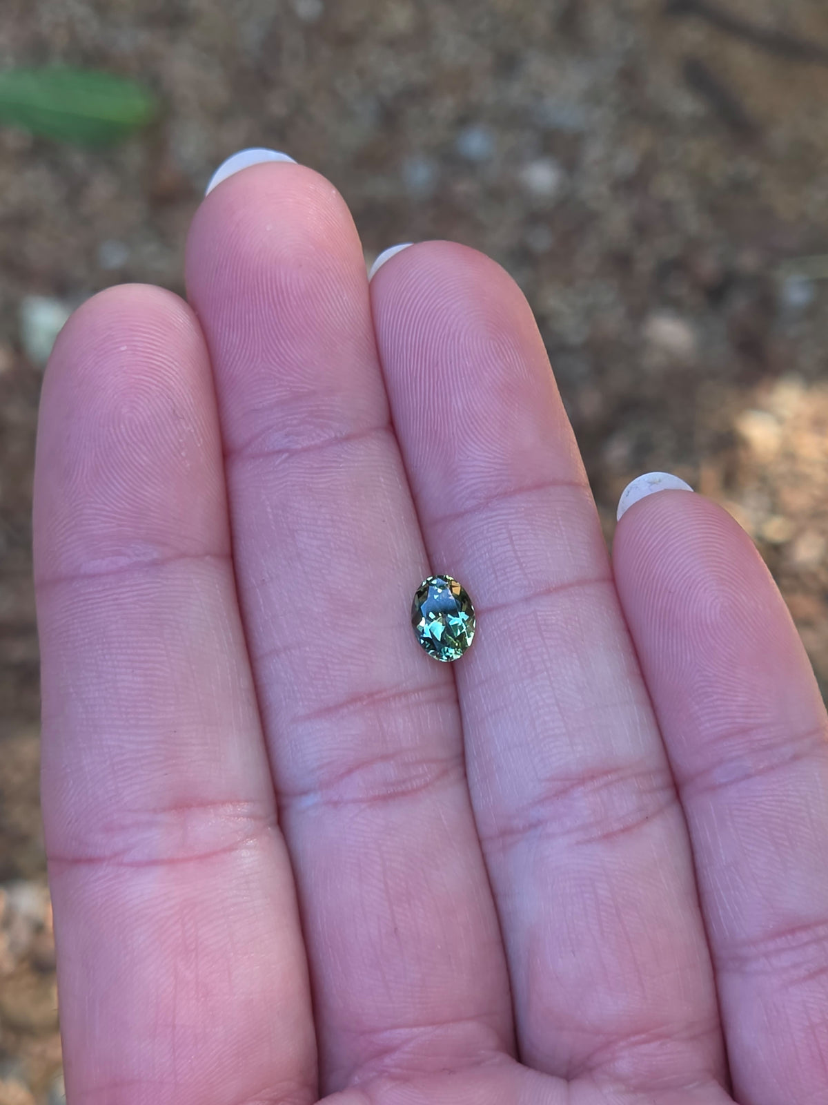 1.12ct Oval Green Parti Sapphire
